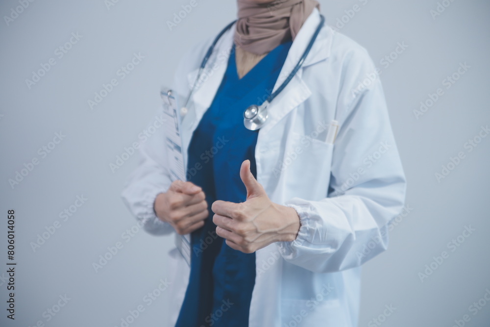 Doctor holding clipboard and stethoscope on background of Hospital ward Doctor holding clipboard and stethoscope on background of Hospital ward