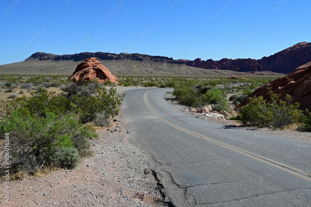 Road running through The Valley of Fire state park on a scorching April day in 2024. Road running through The Valley of Fire state park on a scorching April day in 2024.