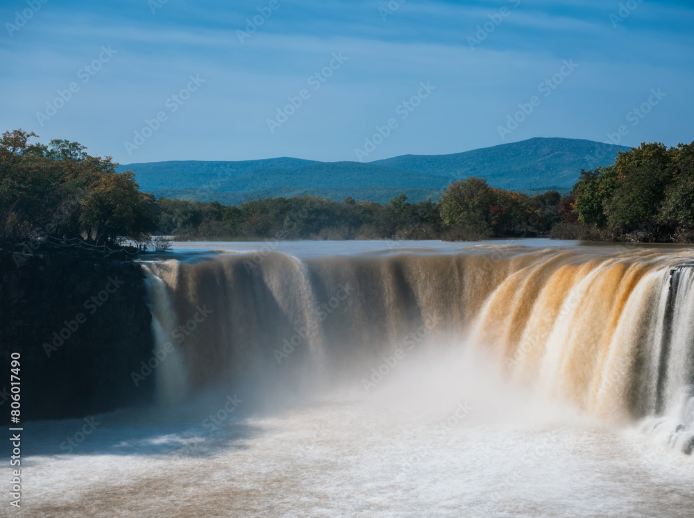 Waterfall at Jingbo Lake Scenic Area in Mudanjiang, Heilongjiang, China in autumn Waterfall at Jingbo Lake Scenic Area in Mudanjiang, Heilongjiang, China in autumn