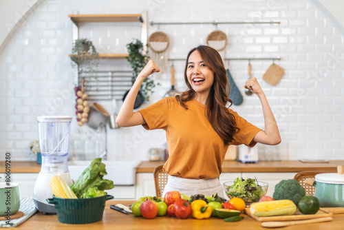 Portrait happy beauty slim healthy asian woman and vegan food healthy fresh vegetable and fruit in kitchen.diet  vegetarian  eating  fruit  wellness  health  green food.Fitness  healthy food