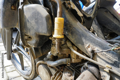 Motorcycle engine carburetor pipe connections are very dirty and rusty