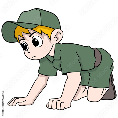 boy scout adventurer is crawling looking for something in the forest