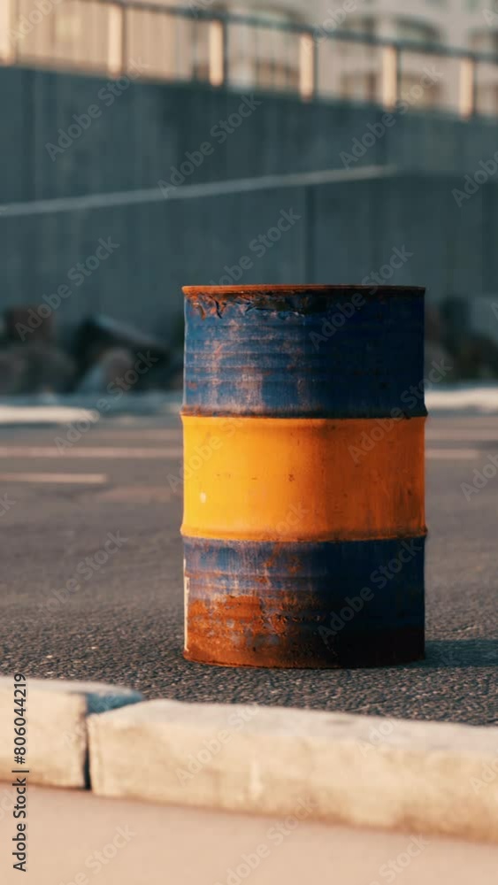 old and rusty metal barrel on parking old and rusty metal barrel on parking