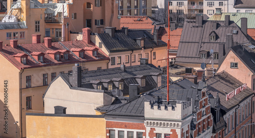 Old yellow 1700s houses at sluice blocks in the district Södermalm, a sunny spring day in Stockholm photo