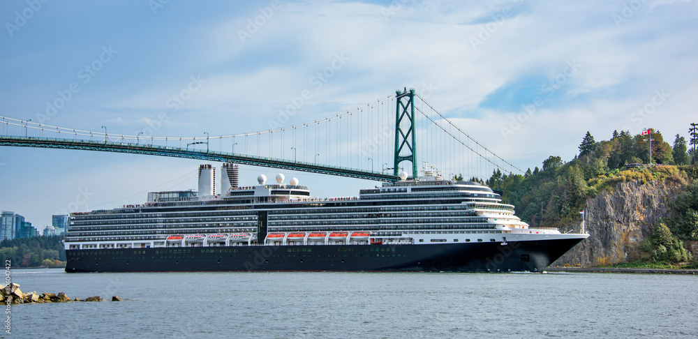 Huge ocean cruise ship passing under famous Lion Gates Bridge. Vancouver, Canada Huge ocean cruise ship passing under famous Lion Gates Bridge. Vancouver, Canada