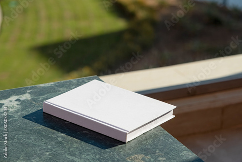 blank book mockup on green marble stone coffee table , shadow overlay