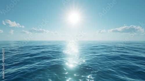 Calm blue ocean with bright shining sun above photo