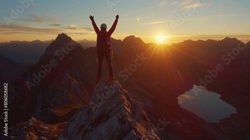 A mountain climber arms raised in triumph