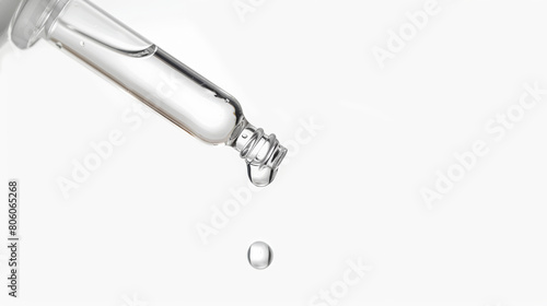 essential oil dropping from syringe, isolated photo