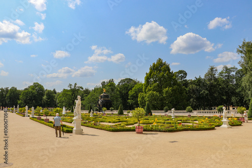 An elderly man explores the beautiful palace gardens in Białystok, summer 2023, Poland, Podlaskie Voivodeship
