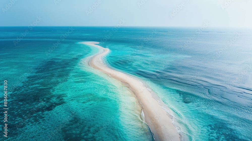 A breathtaking aerial view of a sandy island surrounded by crystal clear Caribbean water. The natural landscape includes a beautiful beach and fluid wind waves AIG50