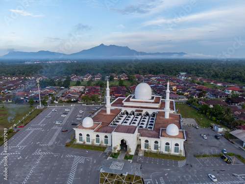 Masjid Al Abyad, Matang Jaya, Kuching Sarawak. Mount Serapi background. photo