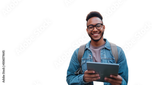 Young black man holding an ipad and smiling, looking at the camera