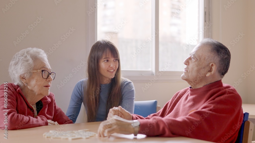 Obraz premium Grandfather talking with the family during a visit in geriatric