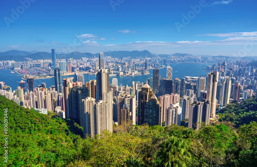 Wonderful panoramic of Hong Kong city view from Victoria Peak, modern cityscape during sunny day in the with amazing summer light clouds.