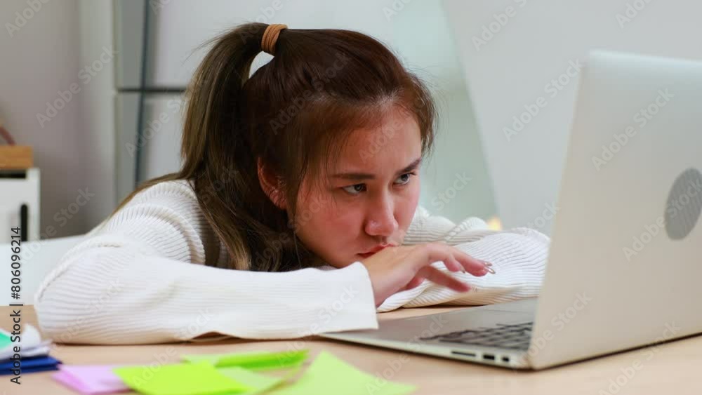 Tired exhausted, fatigue and fell asleep. Yaoung asian thai female working on laptop in kitchen room at home. Overwork. Exhausted woman sleeply eye at workplace Tired exhausted, fatigue and fell asleep. Yaoung asian thai female working on laptop in kitchen room at home. Overwork. Exhausted woman sleeply eye at workplace