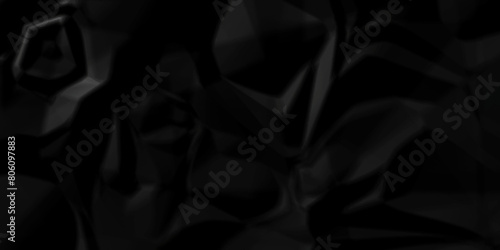 Dark black crumple paper wrinkled poster template ,blank glued creased paper texture background. black paper crumpled backdrop background. used for cardboard. 