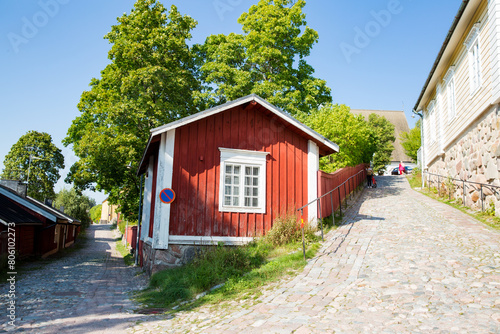 Porvoo, Finland. Narrow streets of Old town of Porvoo. Picturesque colorful wooden houses. Historic center, touristic place, landmark of Finland. Warm sunny summer day in nordic country.