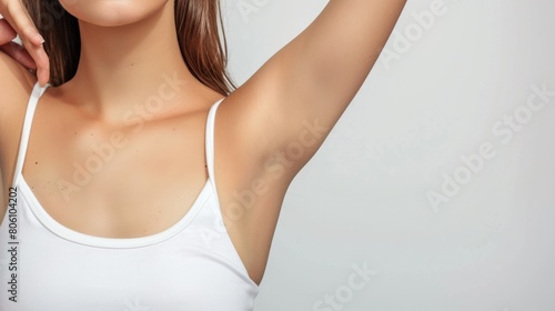 A beautiful woman showing her underarm against on white background. Armpits, Unwanted hair treatment, Hair removal concept.