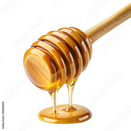 Golden honey flows from a wooden dipper