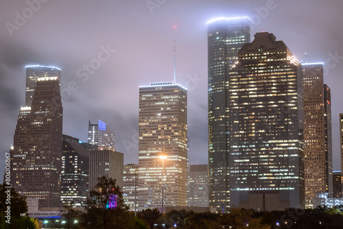 Houston Texas downtown city skyline illuminated buildings. Photo taken on a cloudy foggy evening