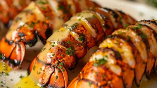 A close-up of succulent lobster tails grilled to perfection, drizzled with melted butter and garnished with fresh herbs, tantalizing the taste buds.