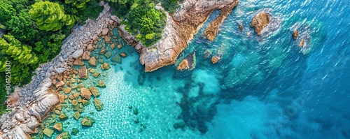 Aerial view of crystal clear water along the coastline with rocky seabed on Veliki Brijun Island, Brijuni National Park, Istria, Croatia. photo