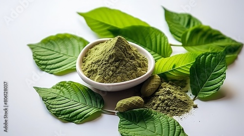 This is kratom leaves and powder. Mitragyna speciosa, kratom, is a tropical evergreen tree in the coffee family native to Southeast Asia. photo