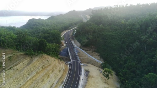 drone lifts off to capture breathtaking aerial footage of the South Coast Road in Tulungagung, East Java, Indonesia. photo