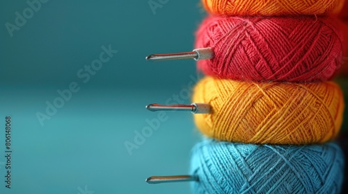 photo of Thread spool with needle on isolated color background photo