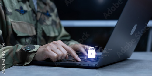 close up soldier man hand type o laptop to check security system of access data in private monitoring room with virtual icon for military operation control and command concept