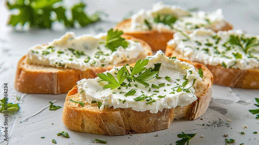 Slices of bread with cream cheese and herbs