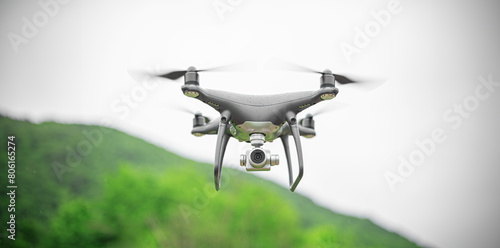 Black flying drone with camera against the background of a forest in the rain.