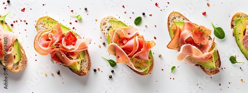 Turkey ham bruschetta on sliced avocado on a white background photo