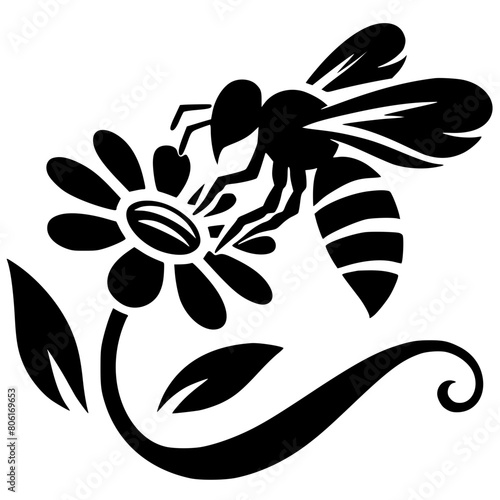 Silhouette of a bee sucking a flower photo