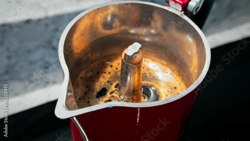 Making flavored coffee in the geyser early in the morning