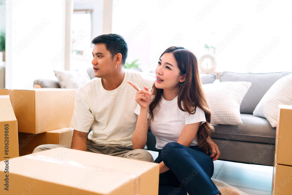 happy family rest discuss decorating house after moving in. man and woman sitting after packing packaging in living room. lover chilling support each other while trying to relocating home using box happy family rest discuss decorating house after moving in. man and woman sitting after packing packaging in living room. lover chilling support each other while trying to relocating home using box
