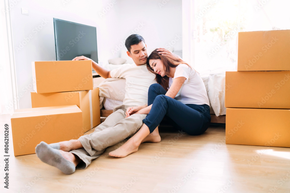 sleepy wife rest husband carrying box up to bedroom. exhausted woman fatigued from lifting too many box packaging up stairs. man worn out from lifting packaging up floor wife lean sitting near bed sleepy wife rest husband carrying box up to bedroom. exhausted woman fatigued from lifting too many box packaging up stairs. man worn out from lifting packaging up floor wife lean sitting near bed