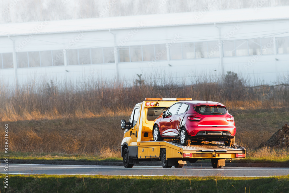 Flatbed Tow Truck in Action. Roadside Recovery 24 at 7 car service. Flatbed Tow Truck in Action. Roadside Recovery 24 at 7 car service.