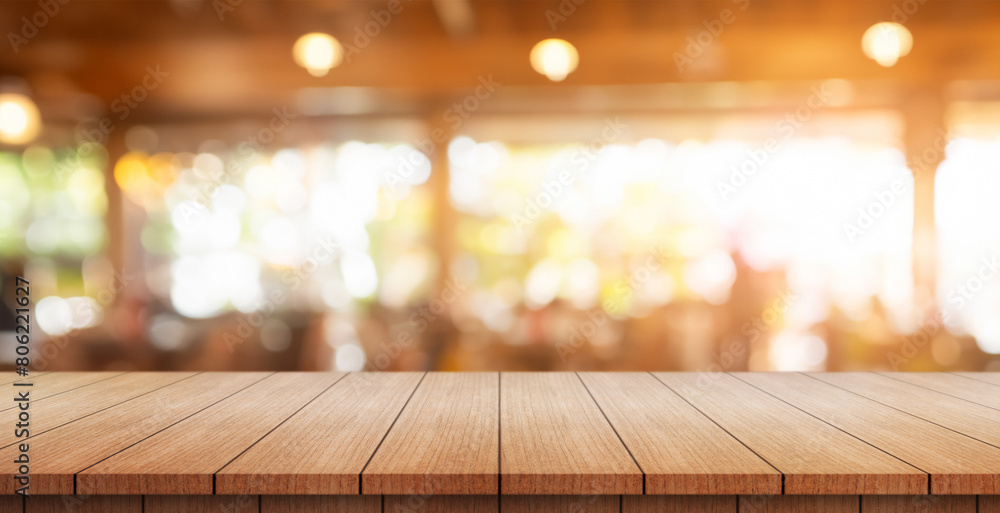 Empty wooden table top with lights bokeh on blur restaurant background Empty wooden table top with lights bokeh on blur restaurant background
