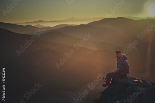 happy person at sunset in the mountain 