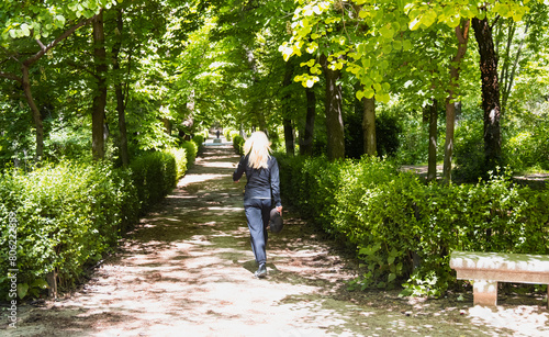Wallpaper Mural Woman running in the Retiro park in Madrid by a lake Torontodigital.ca