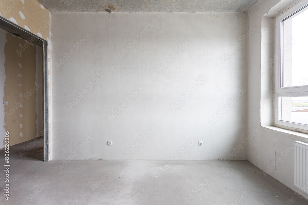 interior of the apartment without decoration in gray colors. rough finish interior of the apartment without decoration in gray colors. rough finish