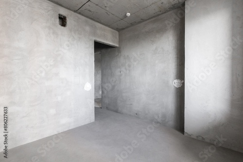interior of the apartment without decoration in gray colors. rough finish
