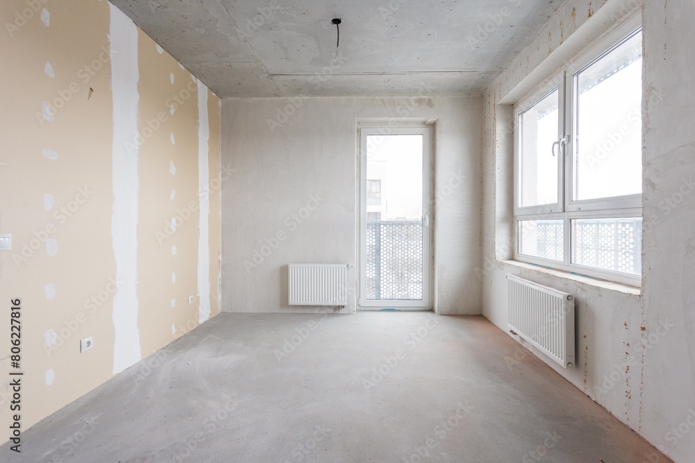 interior of the apartment without decoration in gray colors. rough finish interior of the apartment without decoration in gray colors. rough finish