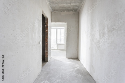 interior of the apartment without decoration in gray colors. rough finish