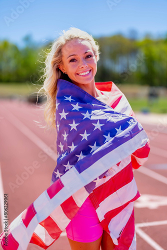 Symbol of Triumph: Proud American Athlete Honors Nation with Flag Display