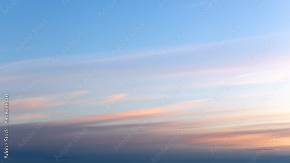 Tender pink and blue summer evening sky.