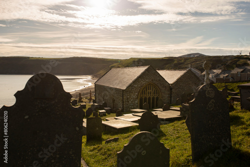 St. Hywyn's Church, Aberdaron, Wales in evening sunlight. An important place of pilgrimage which is part of the North Wales Pilgrim's Way. photo