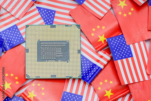 CPU Central Processing Unit or GPU microchip on US and Chinese flags showing semiconductor war between two major countries, with the US banning advanced AI chip exports to China for security reasons. photo